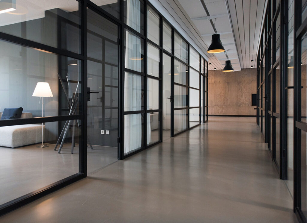 About - Modern Office Interior With Black Frames and Windows
